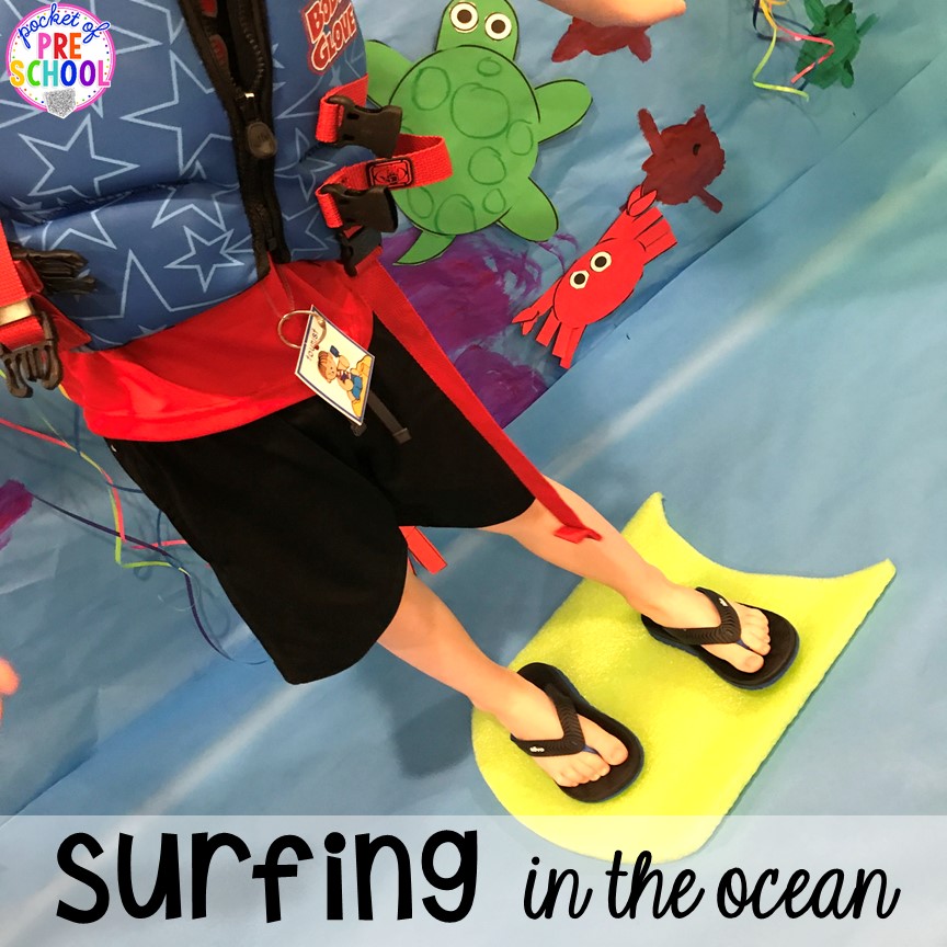 Pretend to surf. Set up a Beach in the dramatic play or pretend center and embed a ton of math, literacy, and STEM into their play! #dramaticplay #pretendplay #preschool #prek #beachtheme #oceantheme